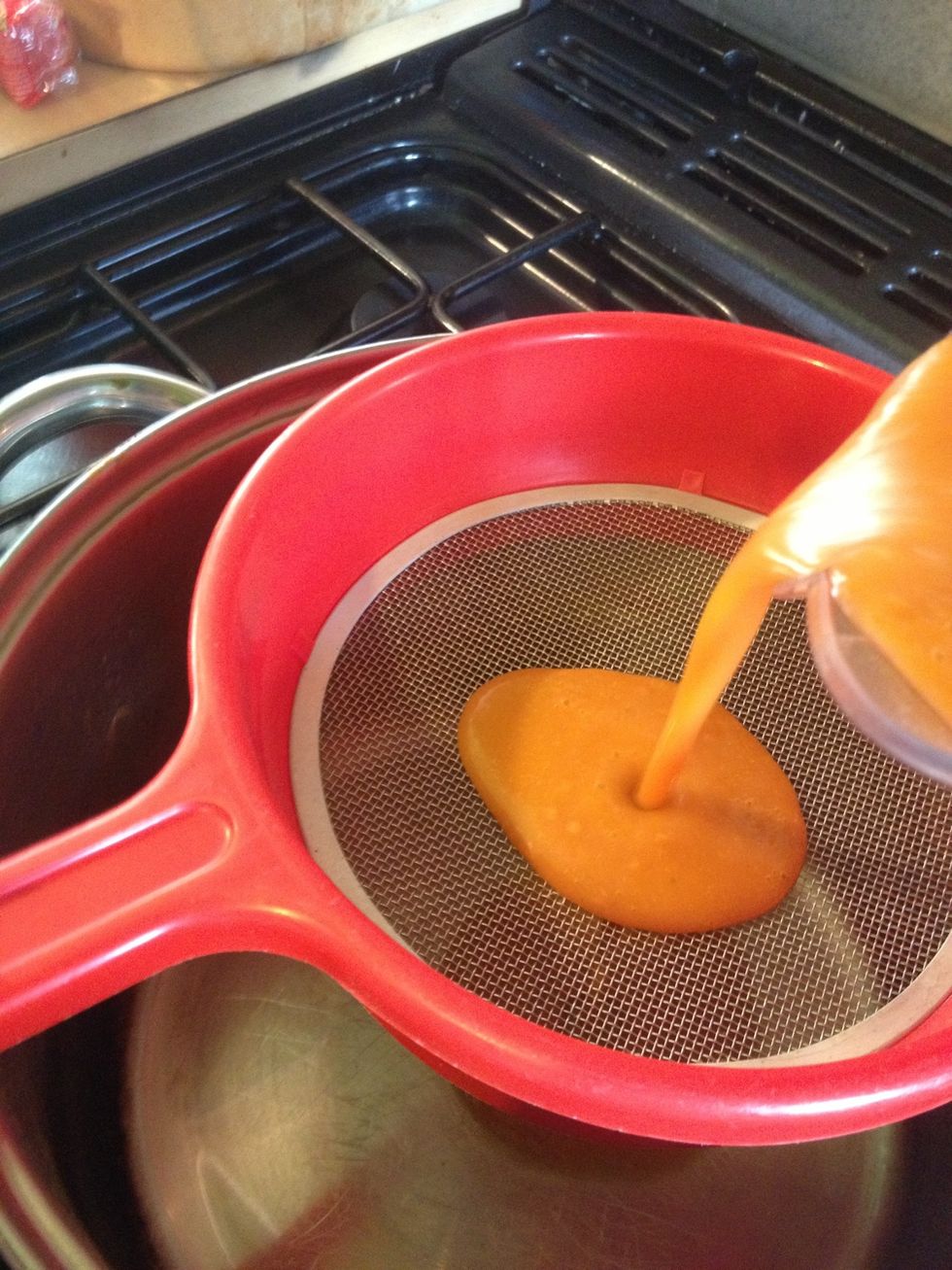 Put it back in the (cleaned) pan through a sieve.