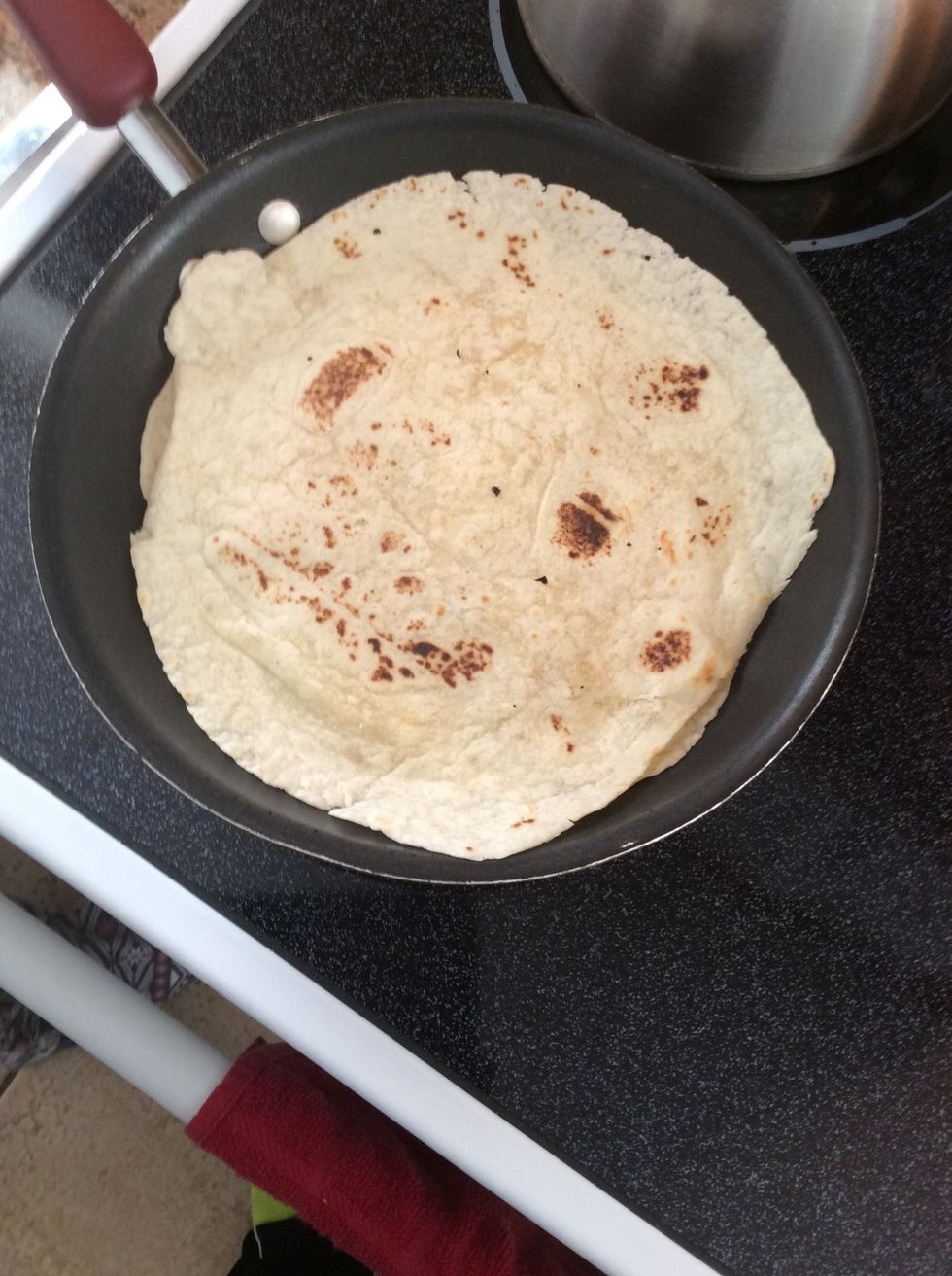 Put it back in the pan and let the cheese melt. Flip it until both sides are splotted brown.