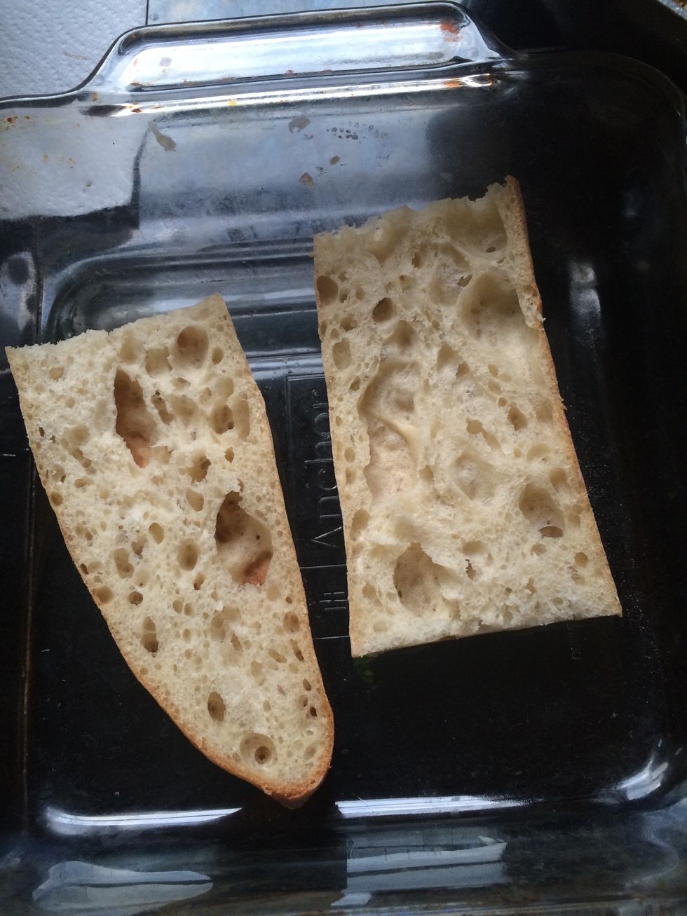 Put it in a baking dish, brush with olive oil