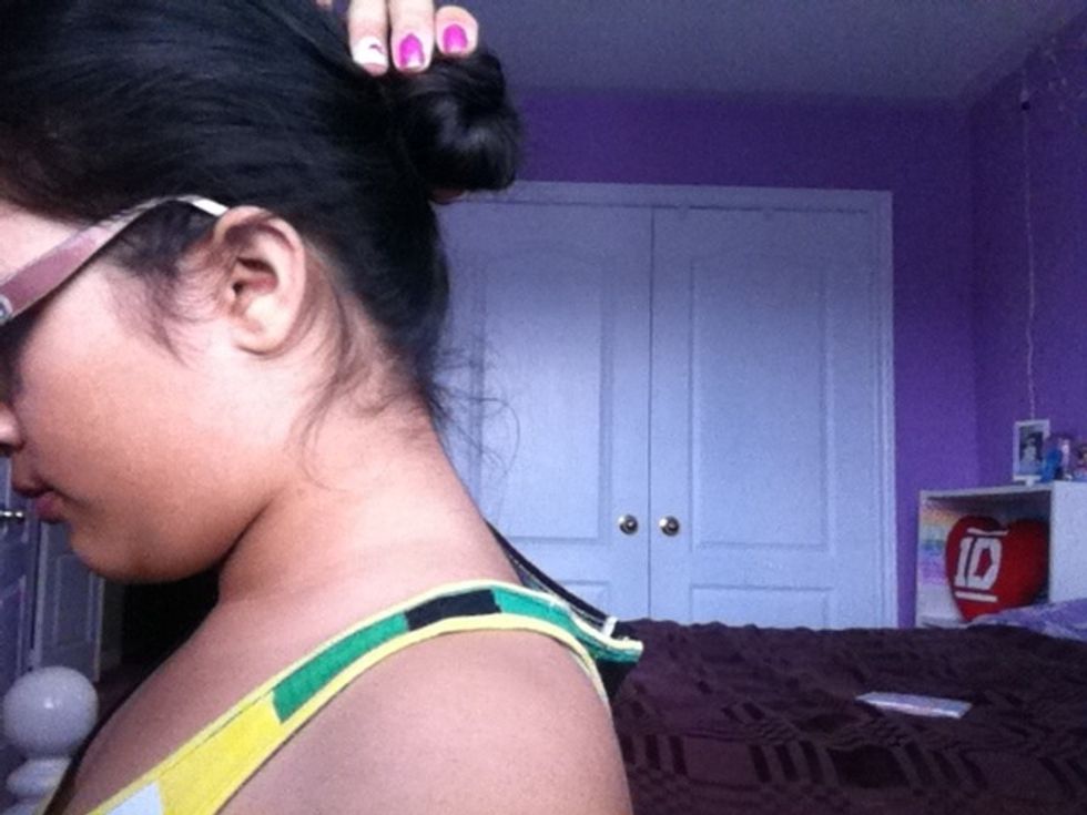 Put it in a bun twisting the hair in a circular motion