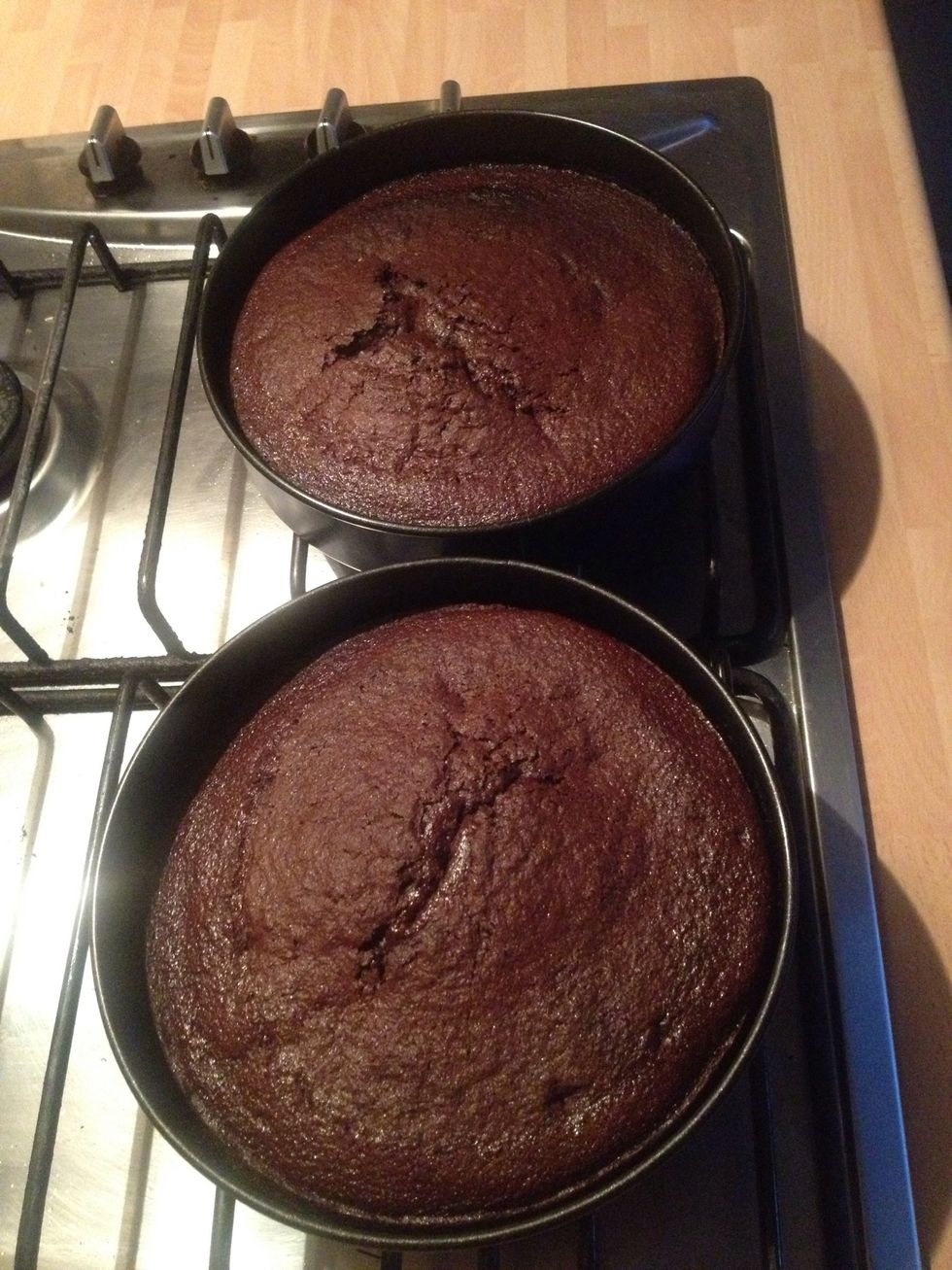 Put it in a heated oven at 180C gas mark 4 for about 20-25. Check with a knife to see if it comes out clear. Let the cakes completely cool down.
