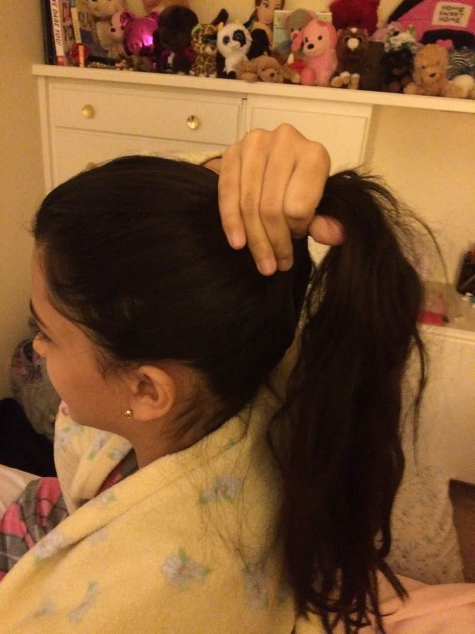 Put it in a ponytail, but do not put an elastic.