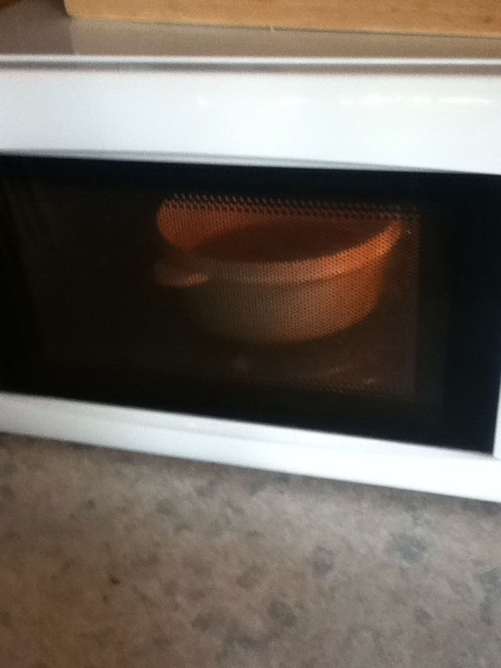 Put it in the microwave. Heat in 30 second intervals, and stir after every 30 seconds. You can also put the chocolate and butter into a bowl, and melt over a pan of boiling water.