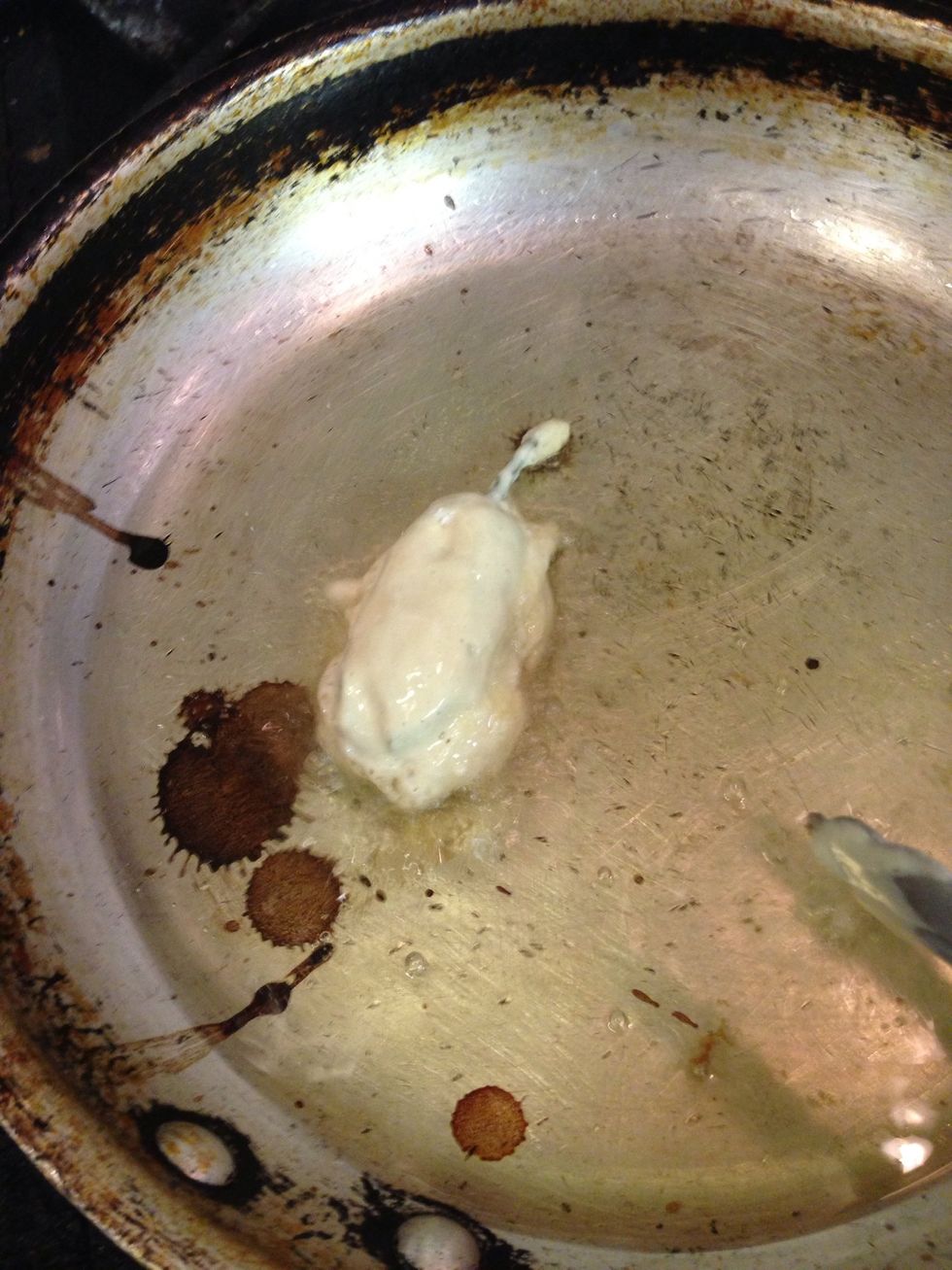 Put it in the oil and roll it carefully till it looks like.........