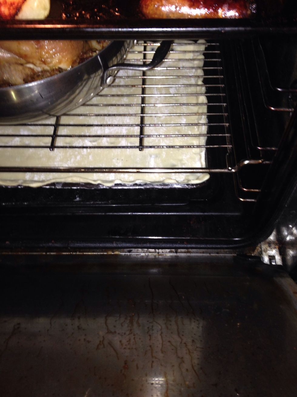 Put it in the oven blind for 5 minutes (sorry cooking a roast above too)