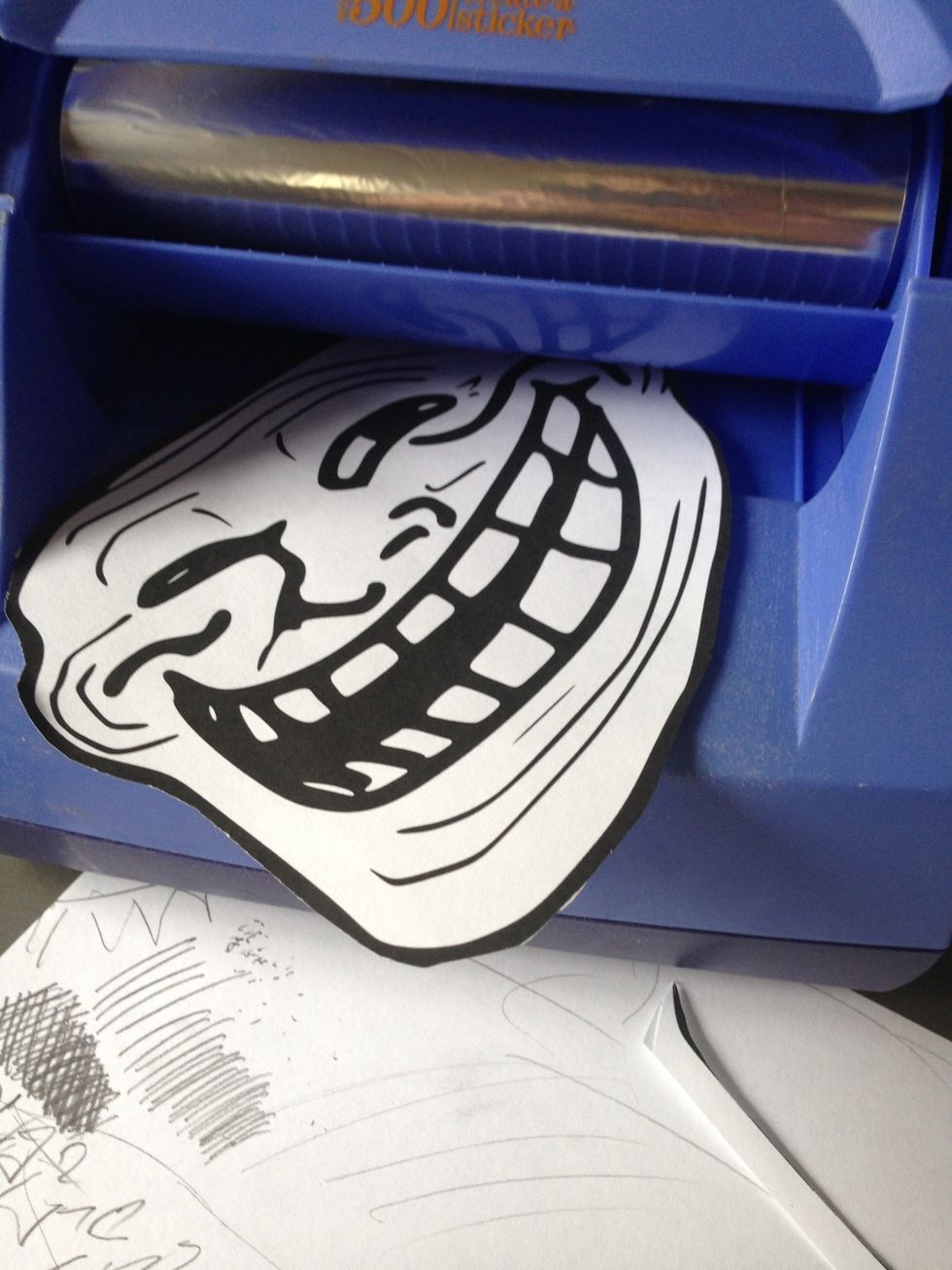 Put it in the xyron 500 sticker machine