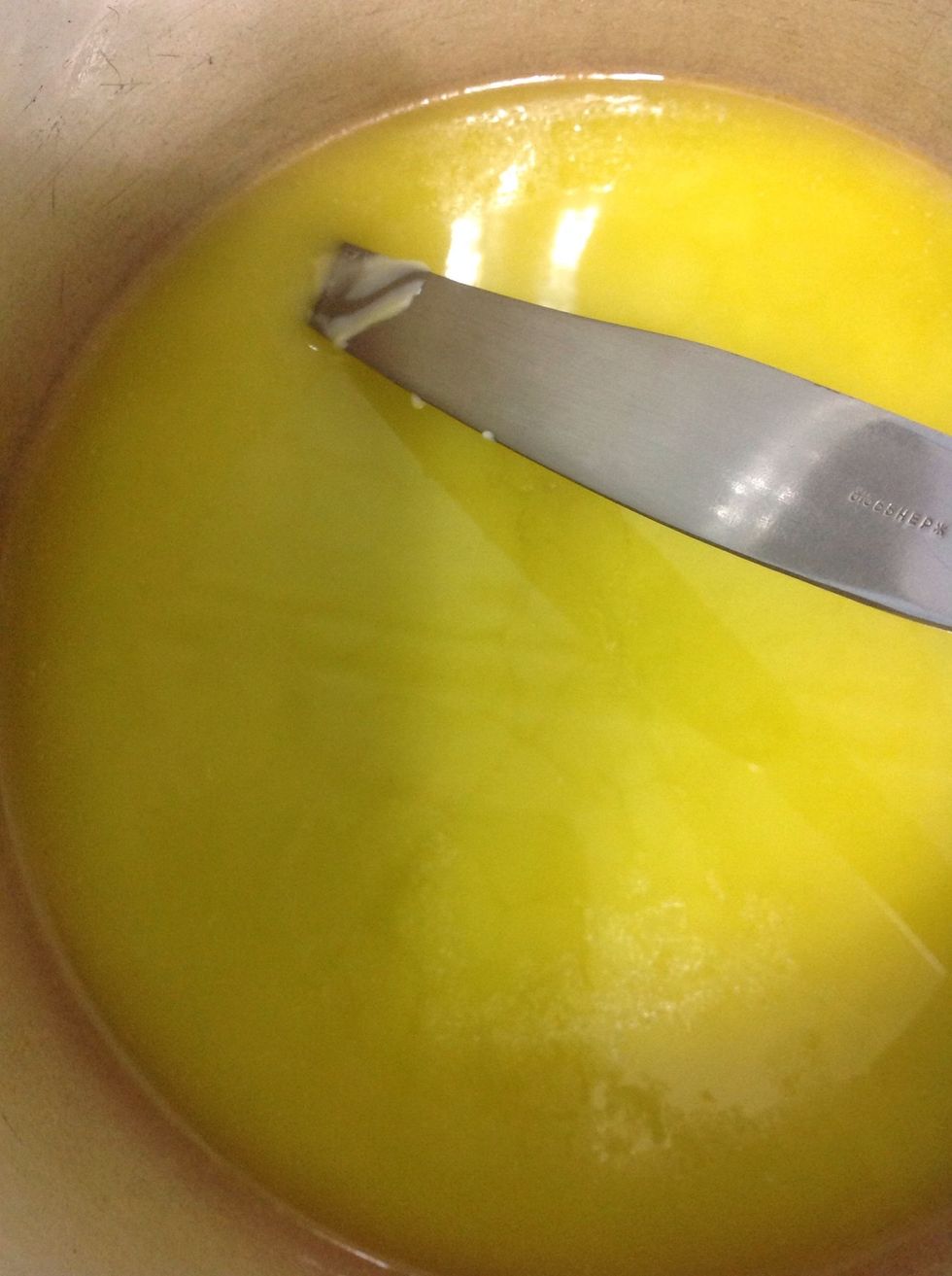 Put it on a cooker and wait till it melts ( don't fry it)