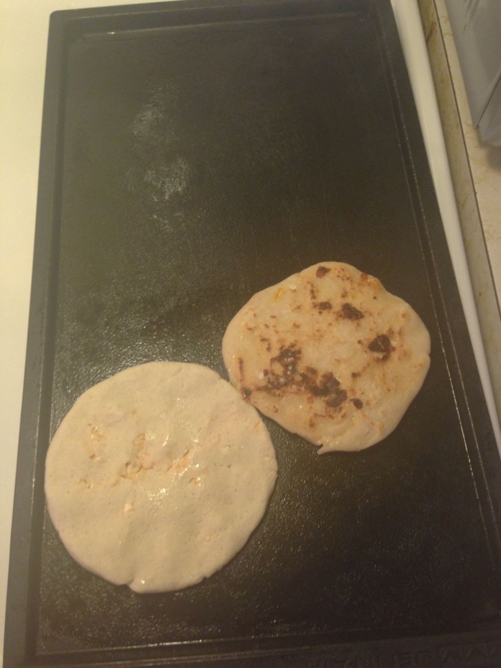 Put it on the flat grill- turn over every so often until you get a golden side, and the cheese has melted - yumm yumm