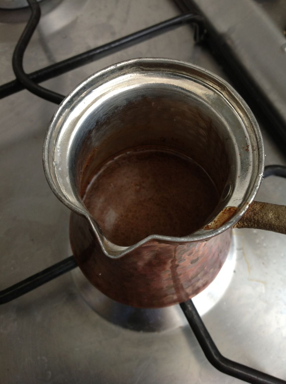 Put it on the heater till it starts to boil. When you feel its going to boil take it from the heater and pour it into your espresso cup