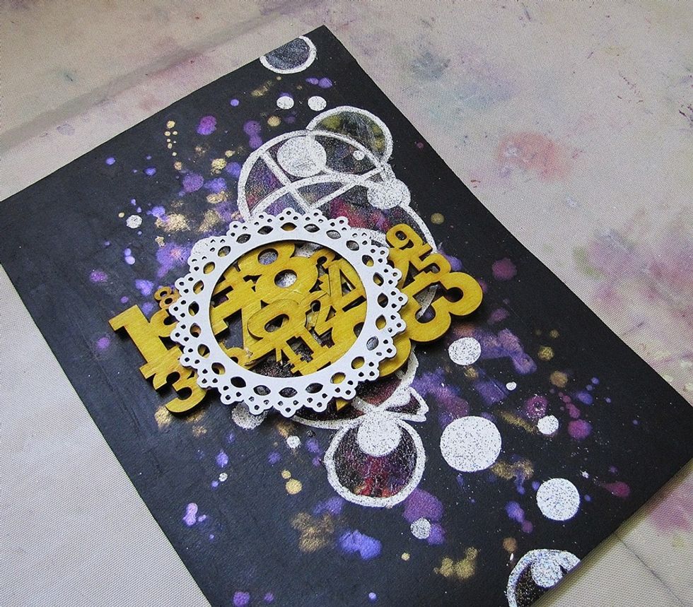 Put it on the page, to see the composition. I decided to add more embossing around the circle, to make the texture more visible.