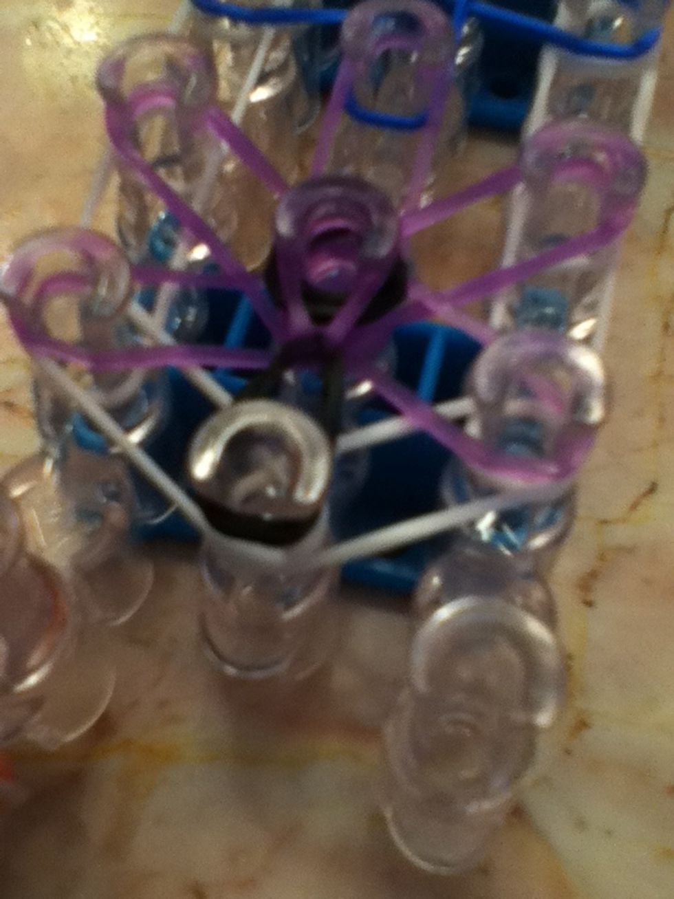 Put it on the peg over it! Go counter clock wise