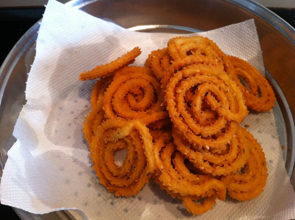 Put it on tissue paper to absorb the excess oil