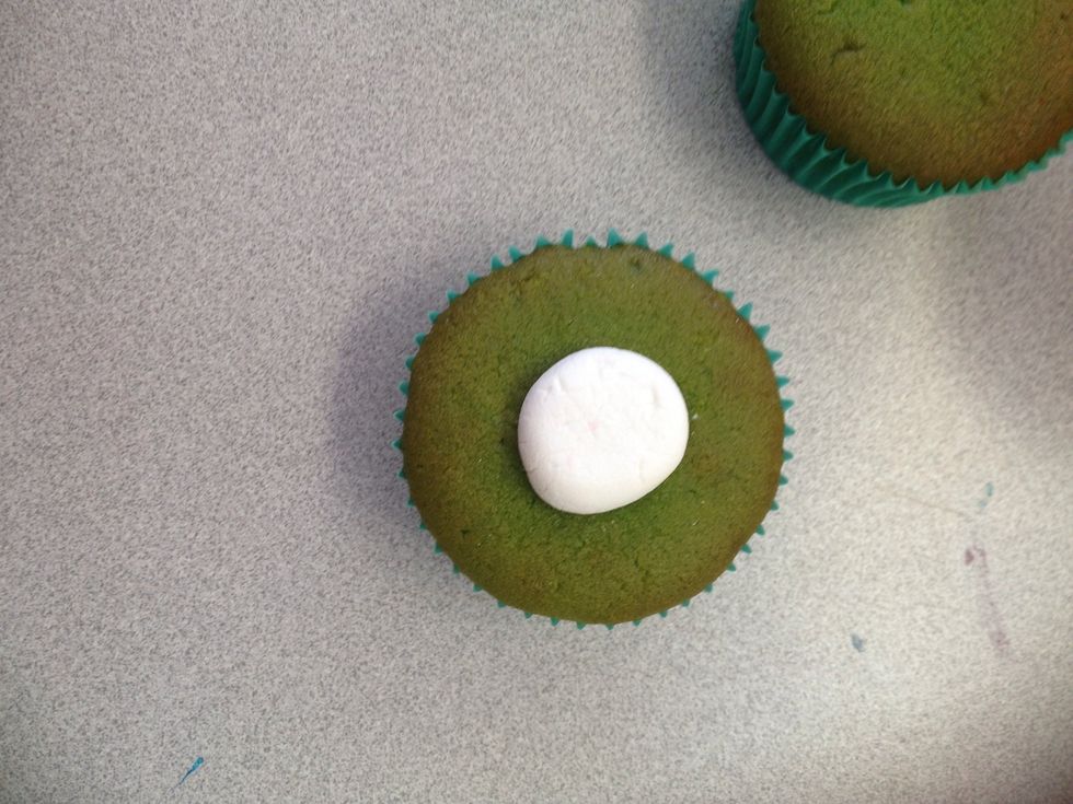 Put it on to the cupcake