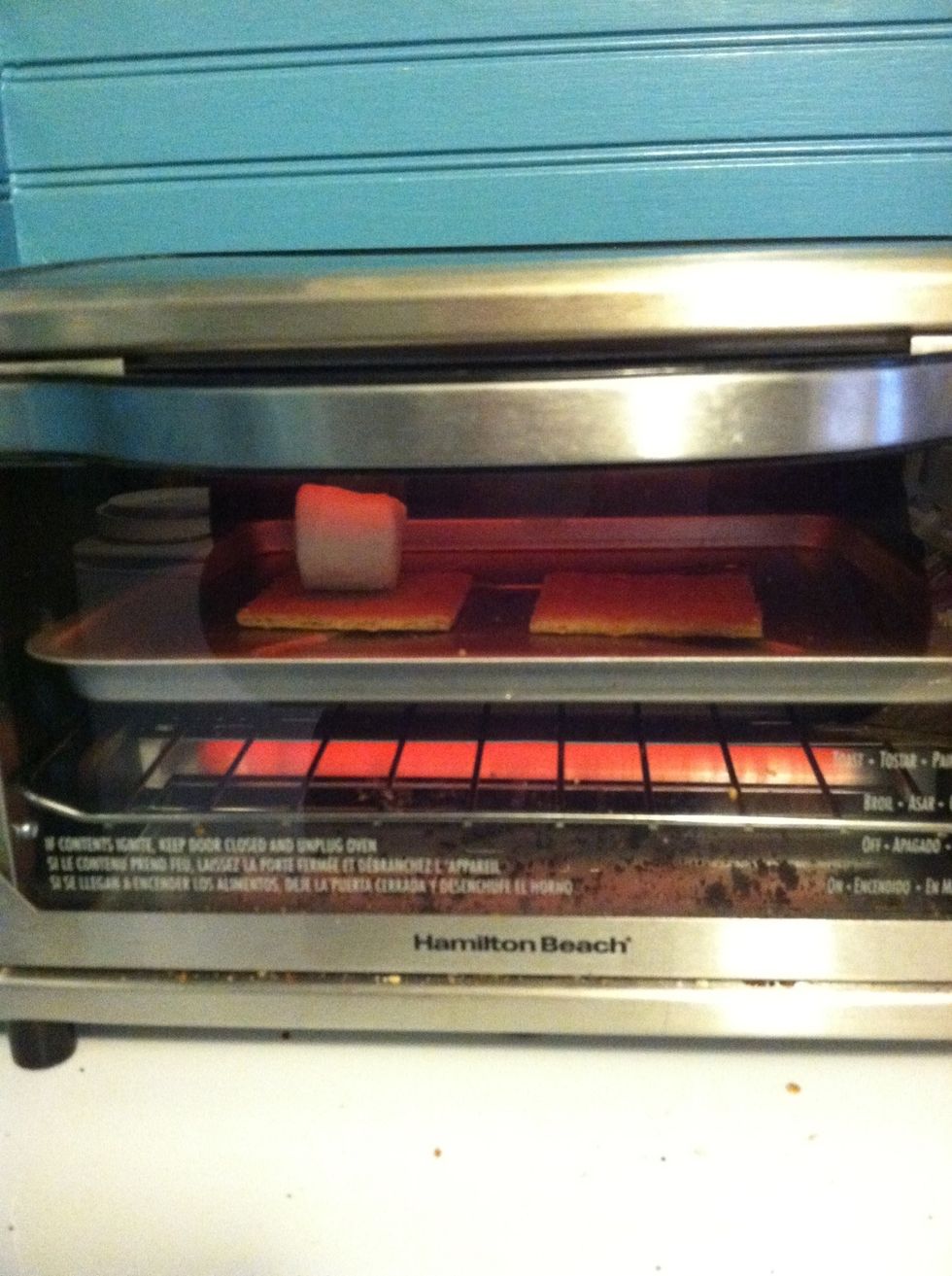 Put it on your toaster oven tray and toast it.. I just do it for a minute or two.. Watch it because it cooks pretty quickly and will burn! When you take the tray out use a mitt it will be hot!!!!!