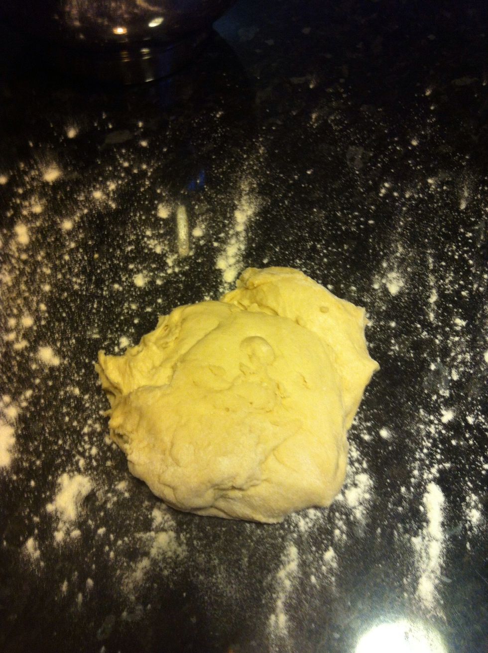 Put it onto the table and briefly hand knead, might be a bit sticky so flour the table a bit.
