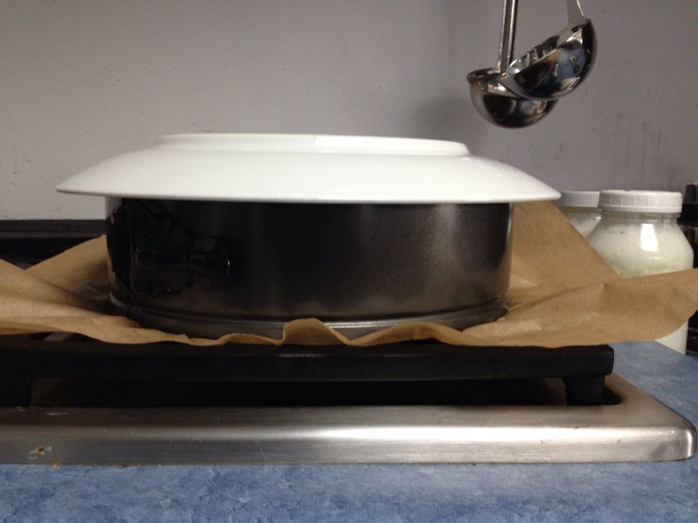 Put it somewhere where air can get underneath it- this will help it cool. Cover it with a glass or porcelain plate immediately. After it's cooled it needs to be refrigerated overnight.