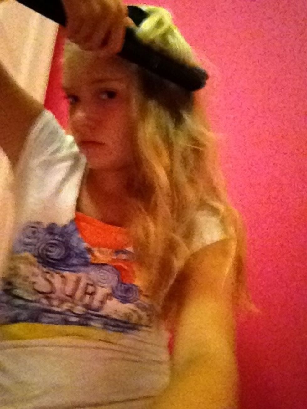 Put it to your hair and then face it down ward to make pretty curls then next step is to do it up wards DON'T HOLD IT ON THERE THEN 10 sec