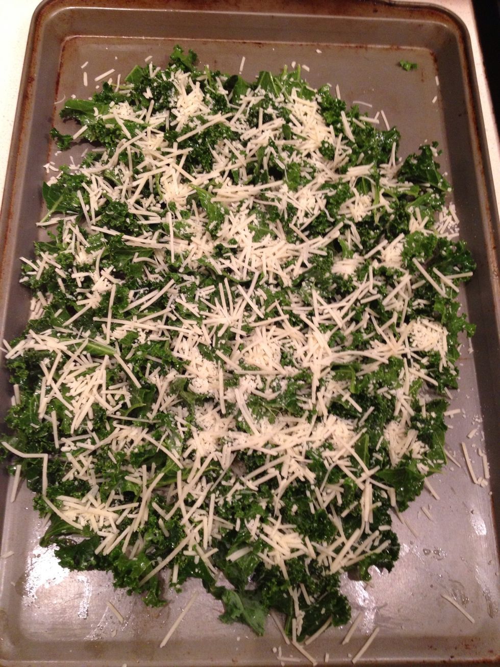 Put kale on cooking sheet and sprinkle Parmesan cheese on the top. Cook in oven at 300 degrees for 8-15 minutes or until the cheese is melted