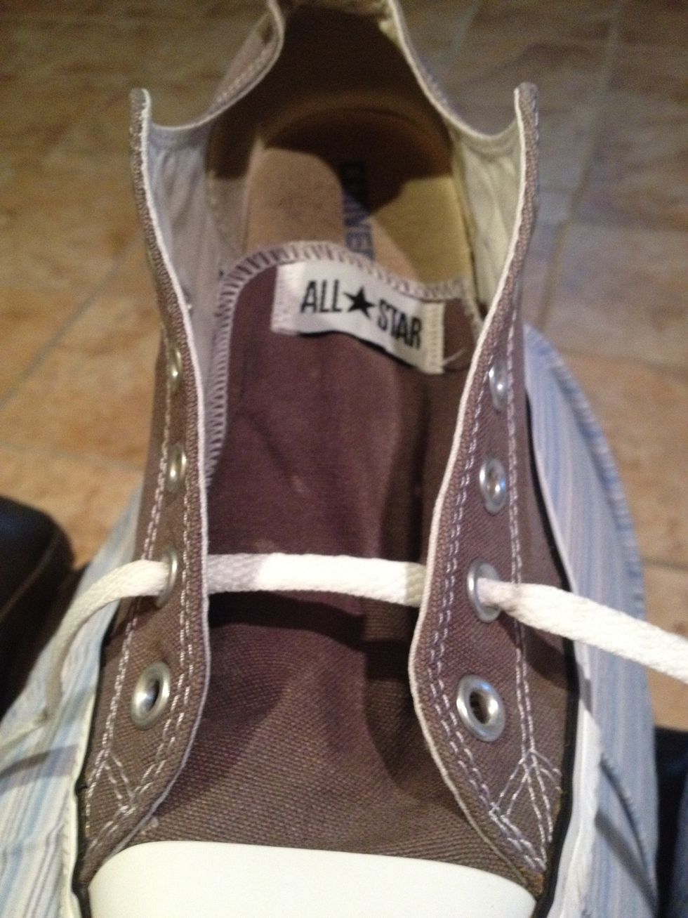 Put lace in the second set of holes and center it.