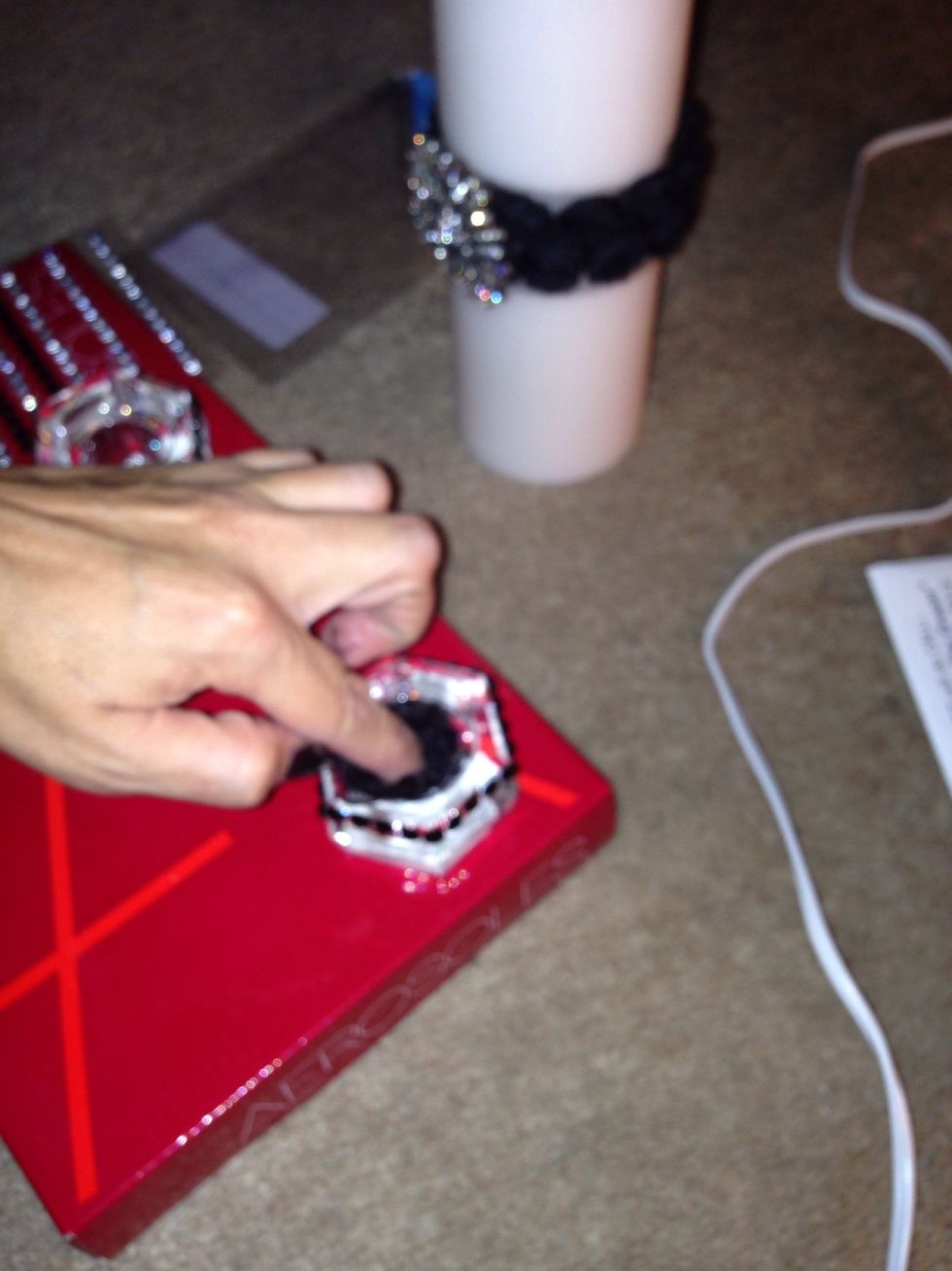 Put lace inside candle holder so that it may insure that the candlestick is secure