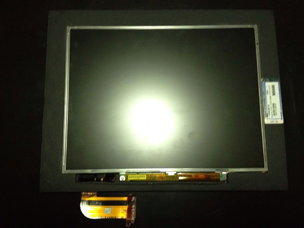 Put LCD panel in foam-core cutout, mark & cut a hole for LCD cable in back board. Glue panel to board on the sides be careful not to touch sensitive area of LCD. Time to measure for matte.