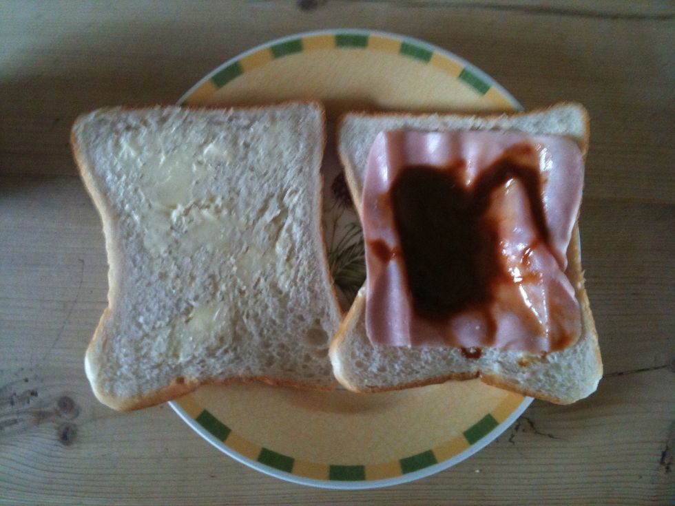 Put marmite on the ham with either the spoon or the knife