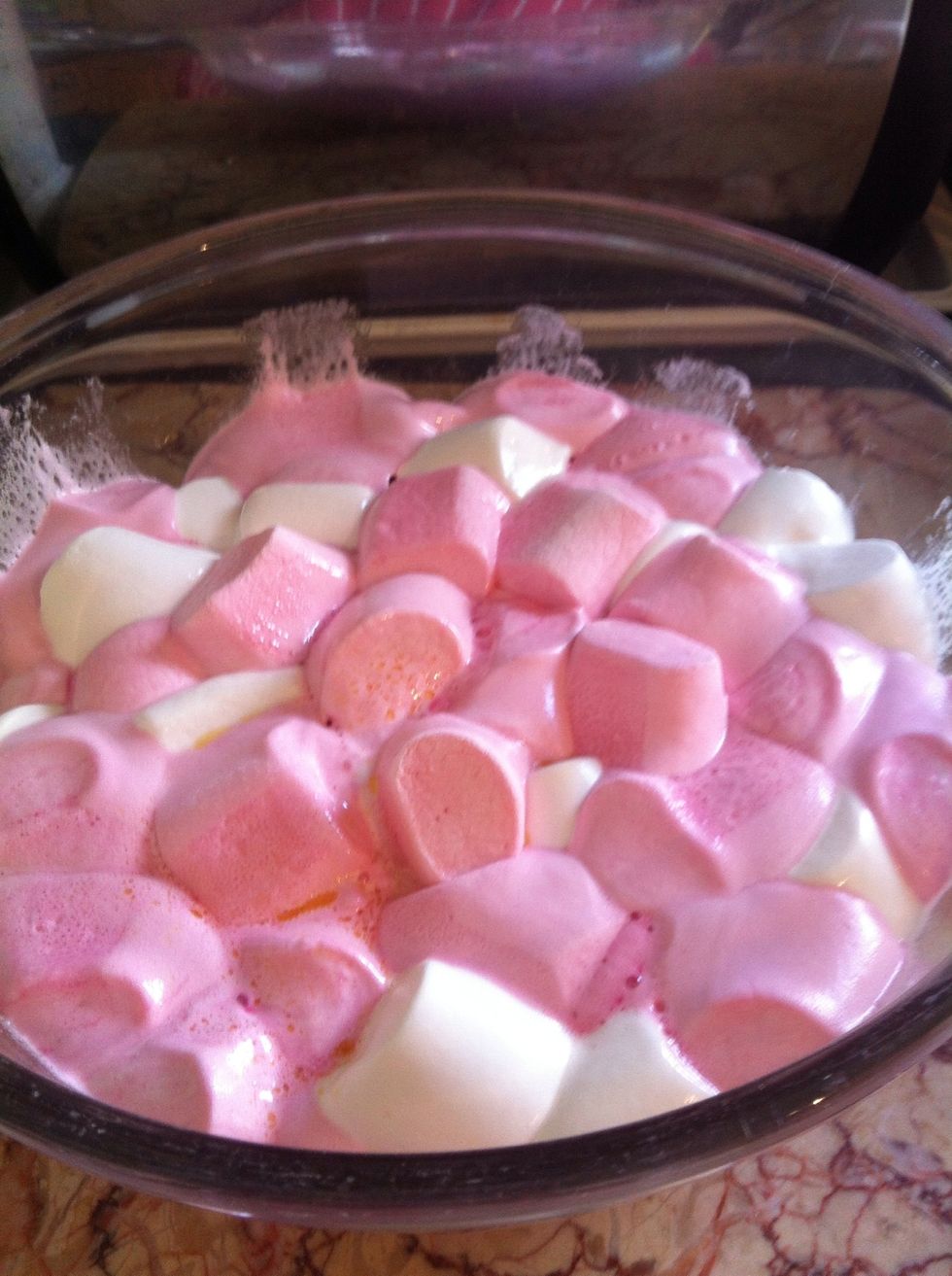 Put marshmallow into microwave and start melting them in 10 second blasts