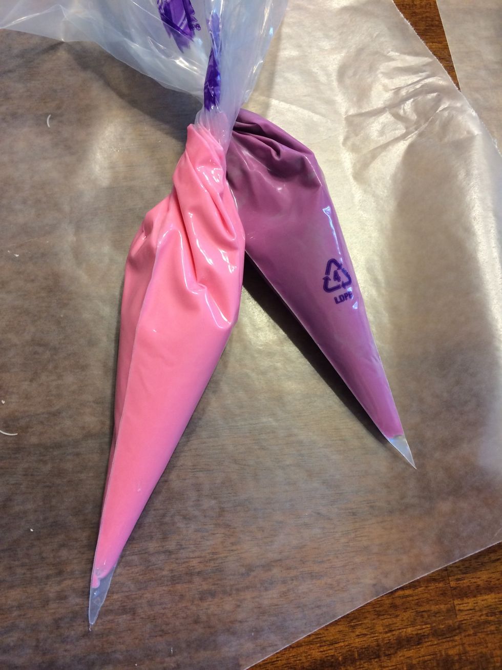 Put melting chocolate of your color and flavor choice into decorating bags
