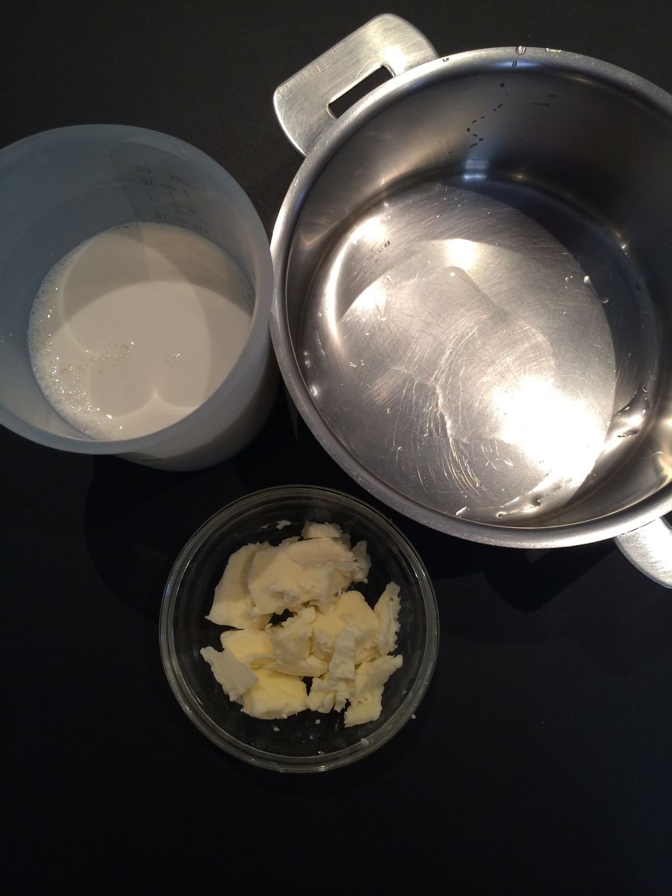 Put Milk 330 ml (a little bit less than 1cup&1/2) + 50 g butter.  A cooking pot (wet so as the milk doesn't stick to the bottom) boil the milk and butter and let them cool down to a warm temperature