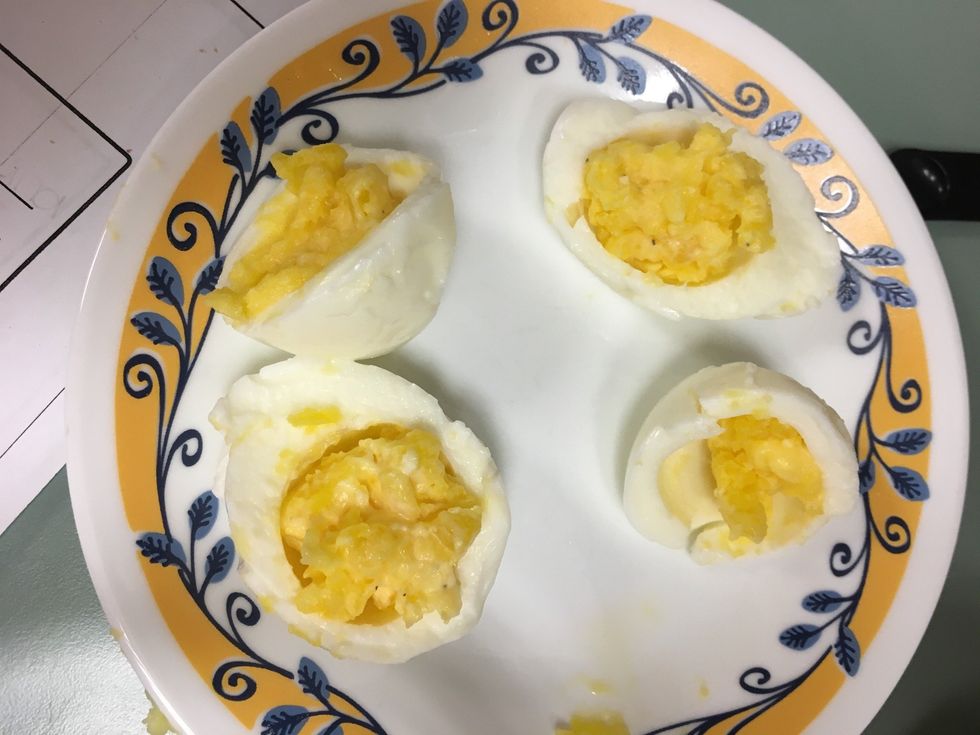 Put mixture into the egg halves.