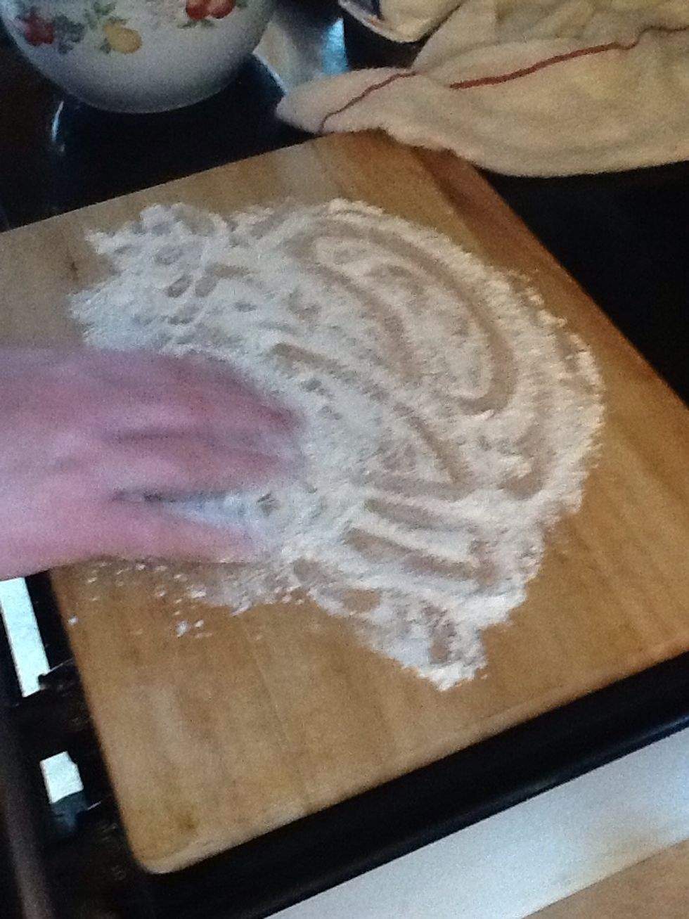 Put more flower on cutting board.
