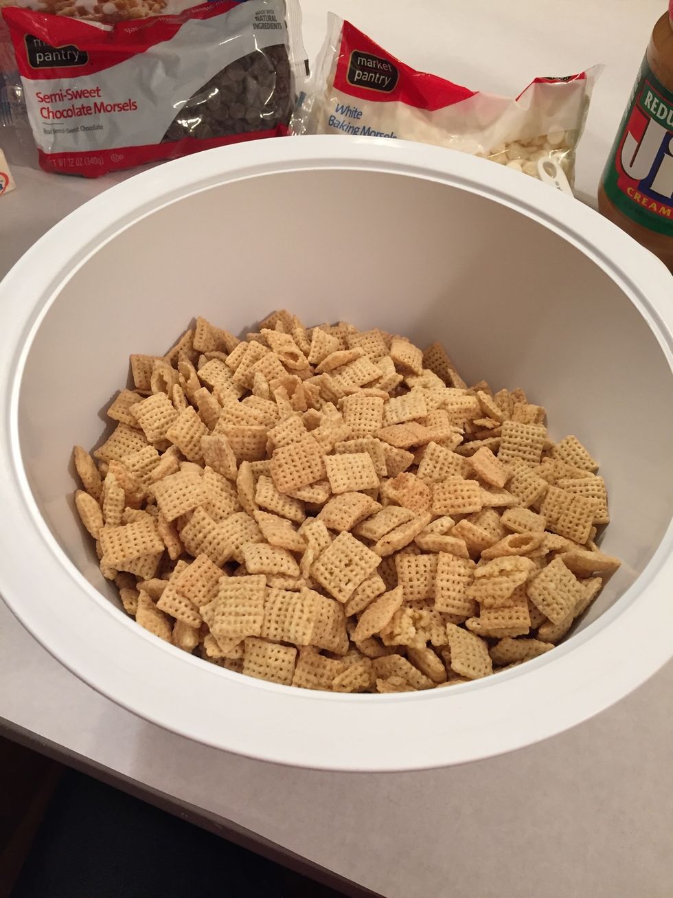 Put nine cups of chex inside a large bowl.