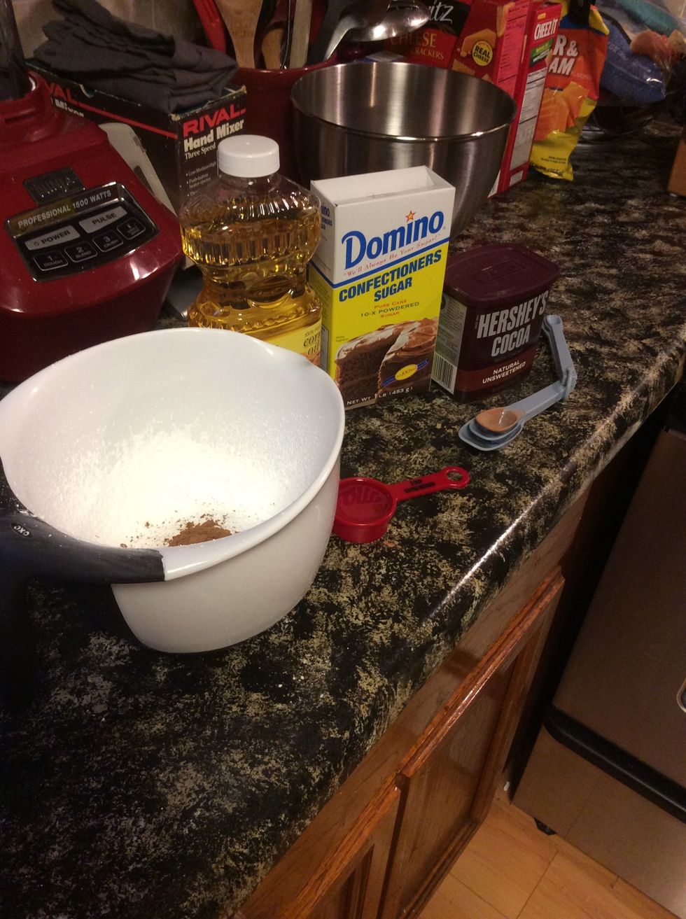 Put oil, confectioners sugar, and cocoa powder in bowl and mix for glaze