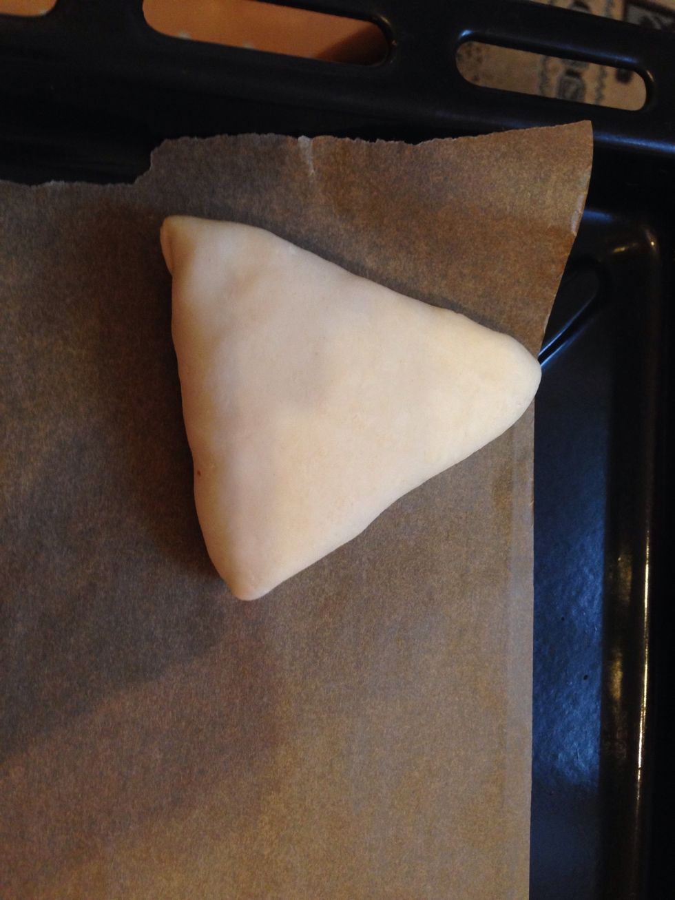 Put on a baking sheet with a stitches down. And set your oven to heat at 400F (200C)