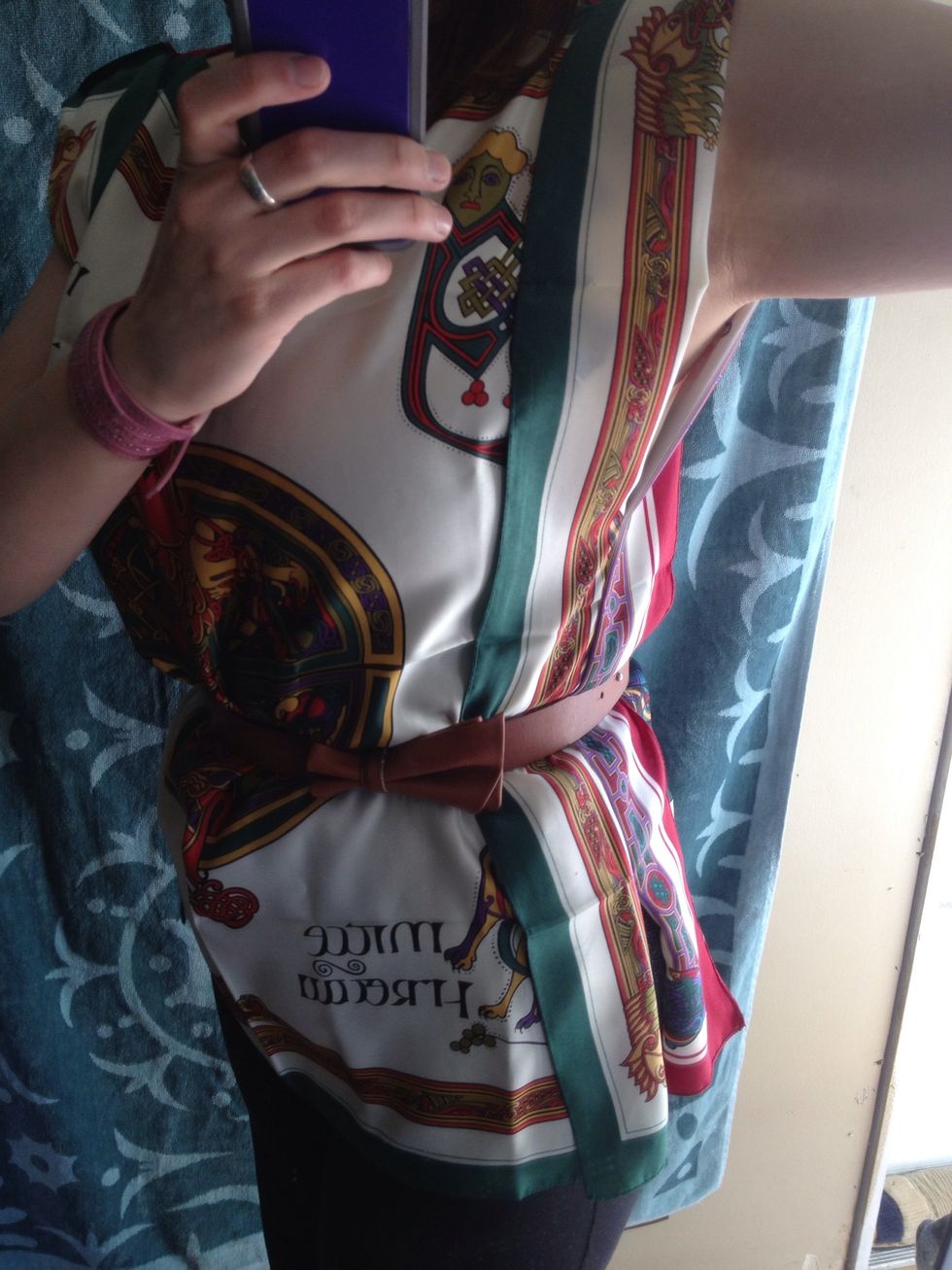 Put on a belt, adjusting keeping the "wings" open and put a belt over top it all.