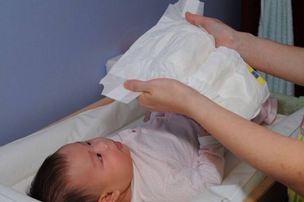 Put on a clean diaper! Make sure diaper is snug around the waist.