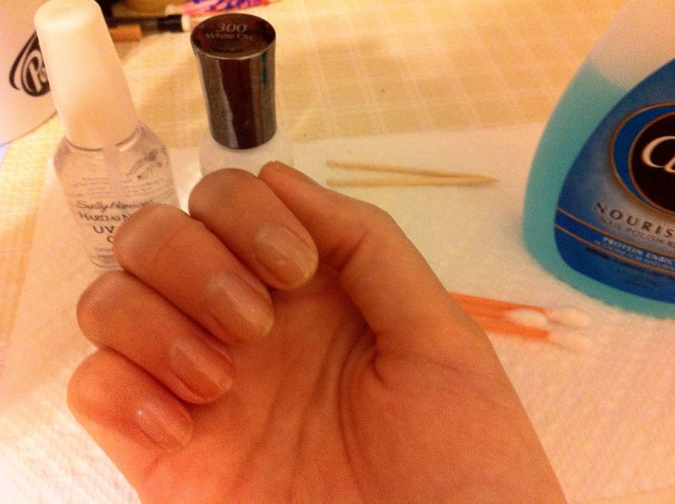 Put on a coat of clear polish so the color won't bleed through your nail and hold the color longer.