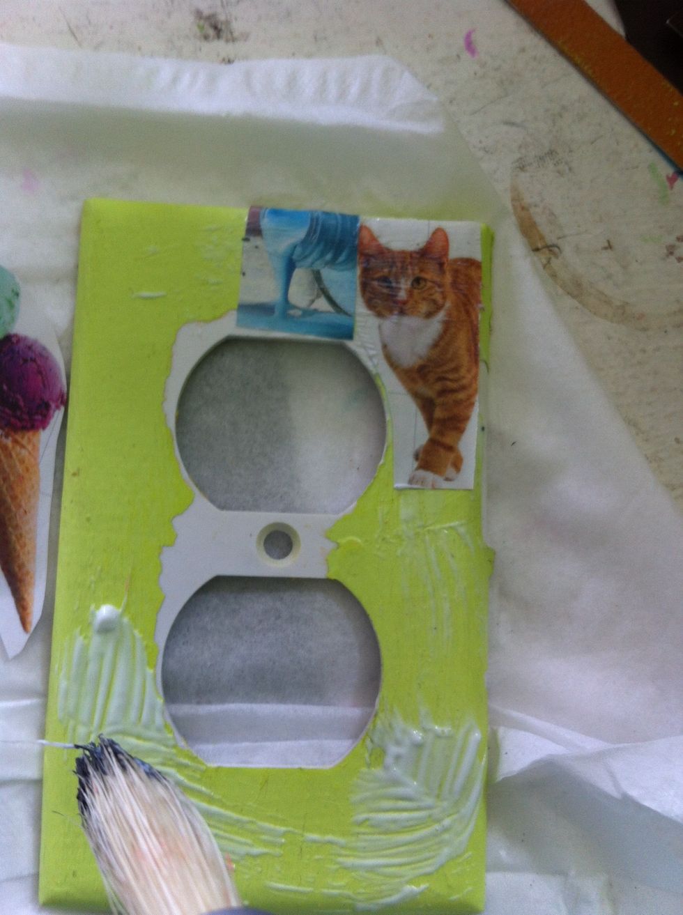 Put on another picture and paint the decoupage over it. It should dry clear