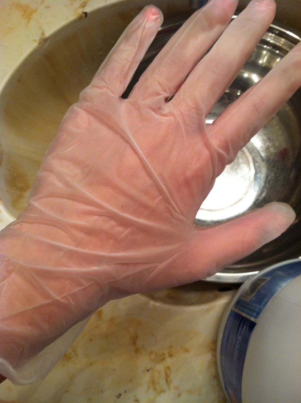 Put on gloves to protect your hands from bleach