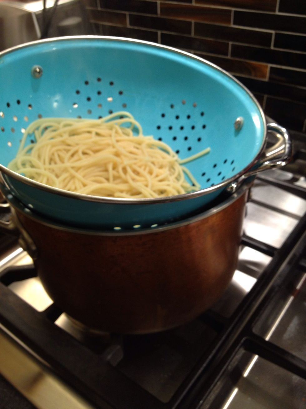 Put on top of the pot so it doesn't drip everywhere. Do this steps quickly so the pasta doesn't cool off.