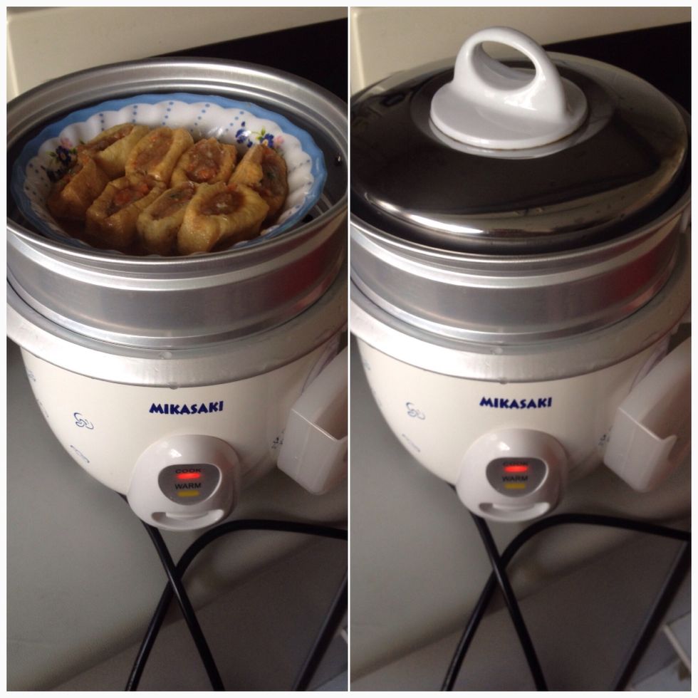 Put on top of the rice, press the button down to start. Cook till the light turn to "warm".