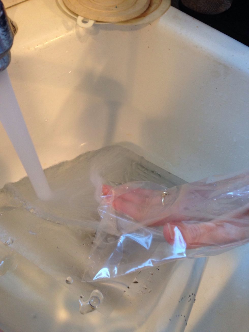 Put on your glove (or a plastic baggie) and rinse off the etching cream. We used hot water to assist with lifting the Contact paper.