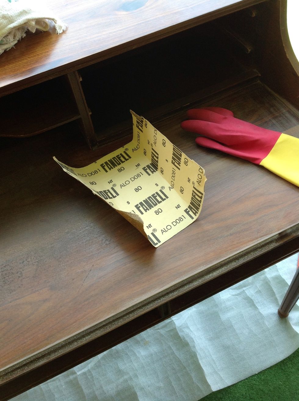 Put on your gloves and start sanding your furniture use your mask powder may fly