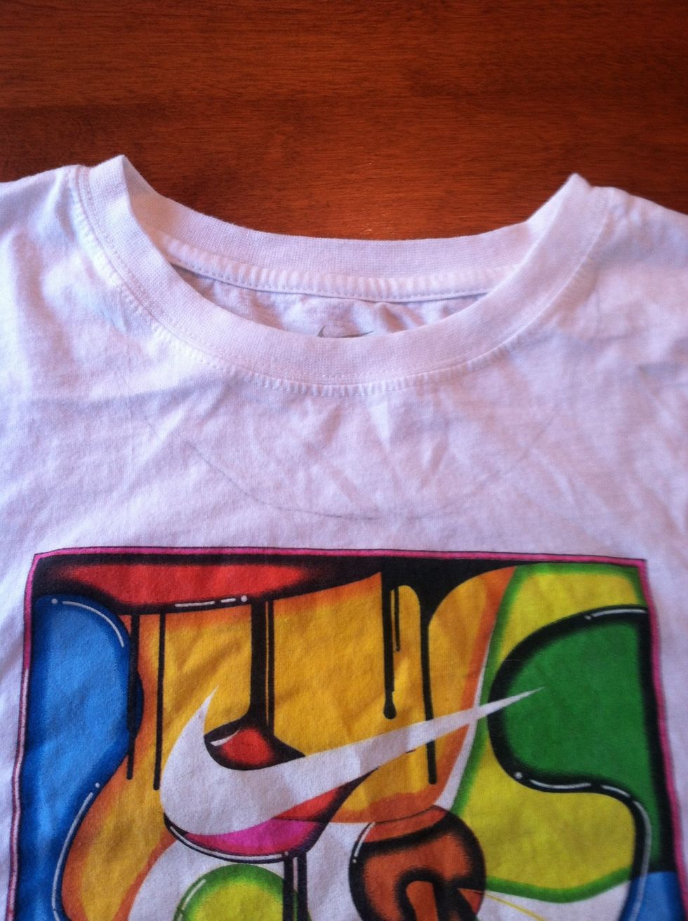 Put on your shirt and mark where you want the neck line to be.