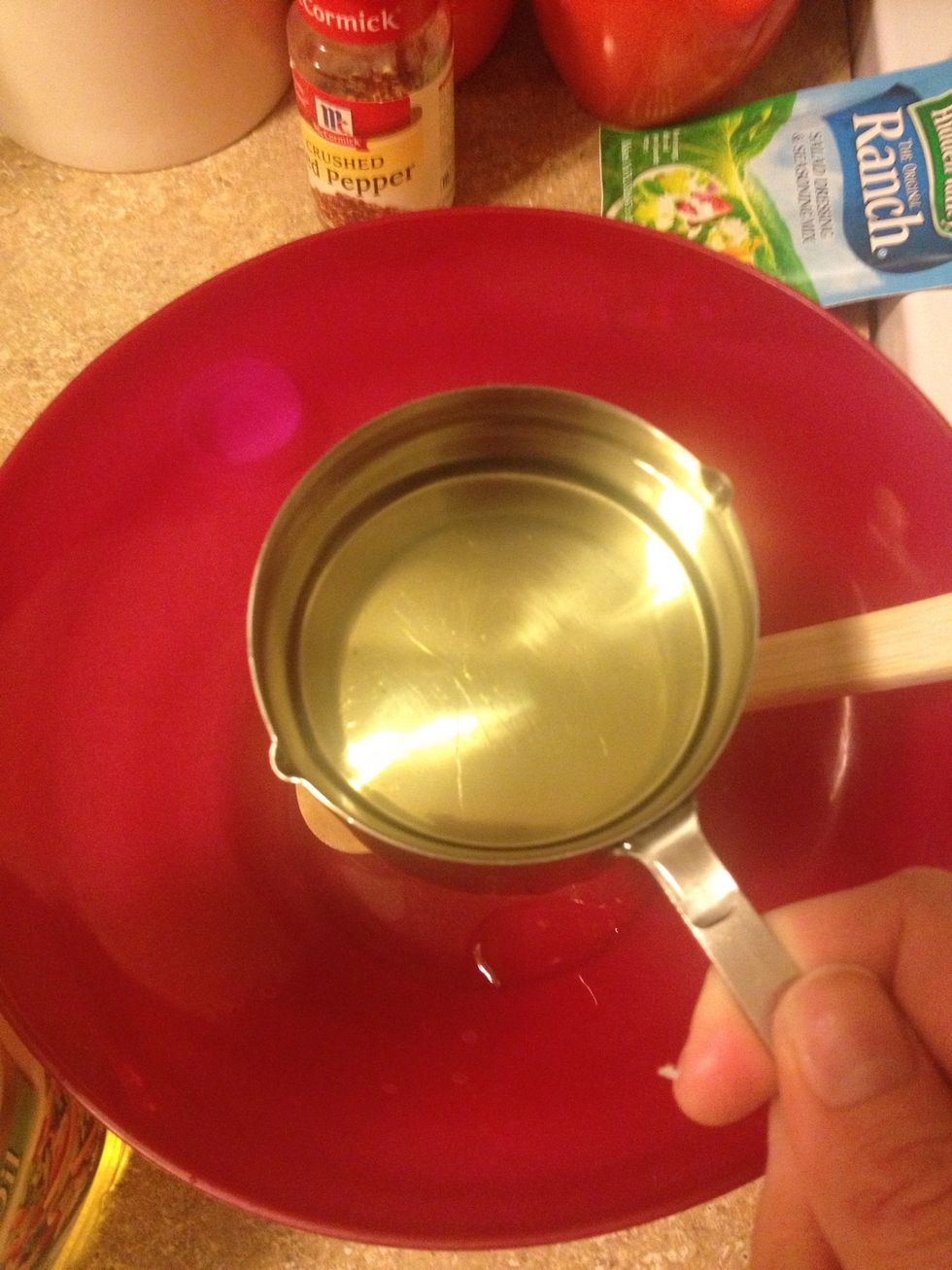 Put one cup canola oil in a mixing bowl