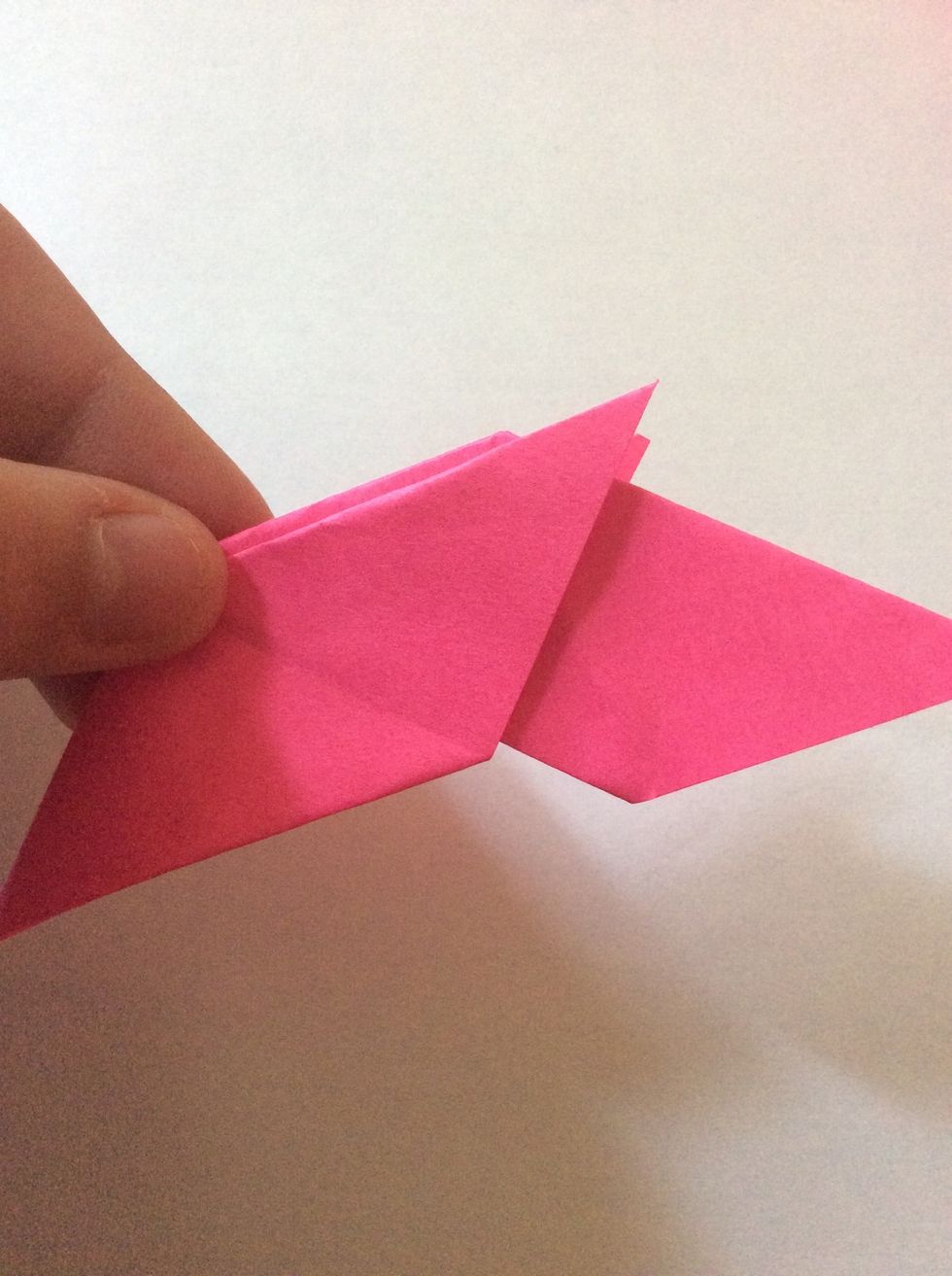 Put one diamond shape into the 2 tails of the other diamond shape