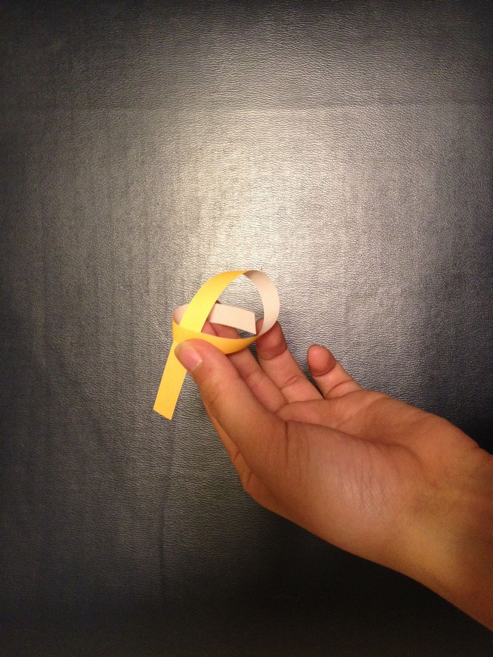 Put one end through the loop, sort of like tying a knot.