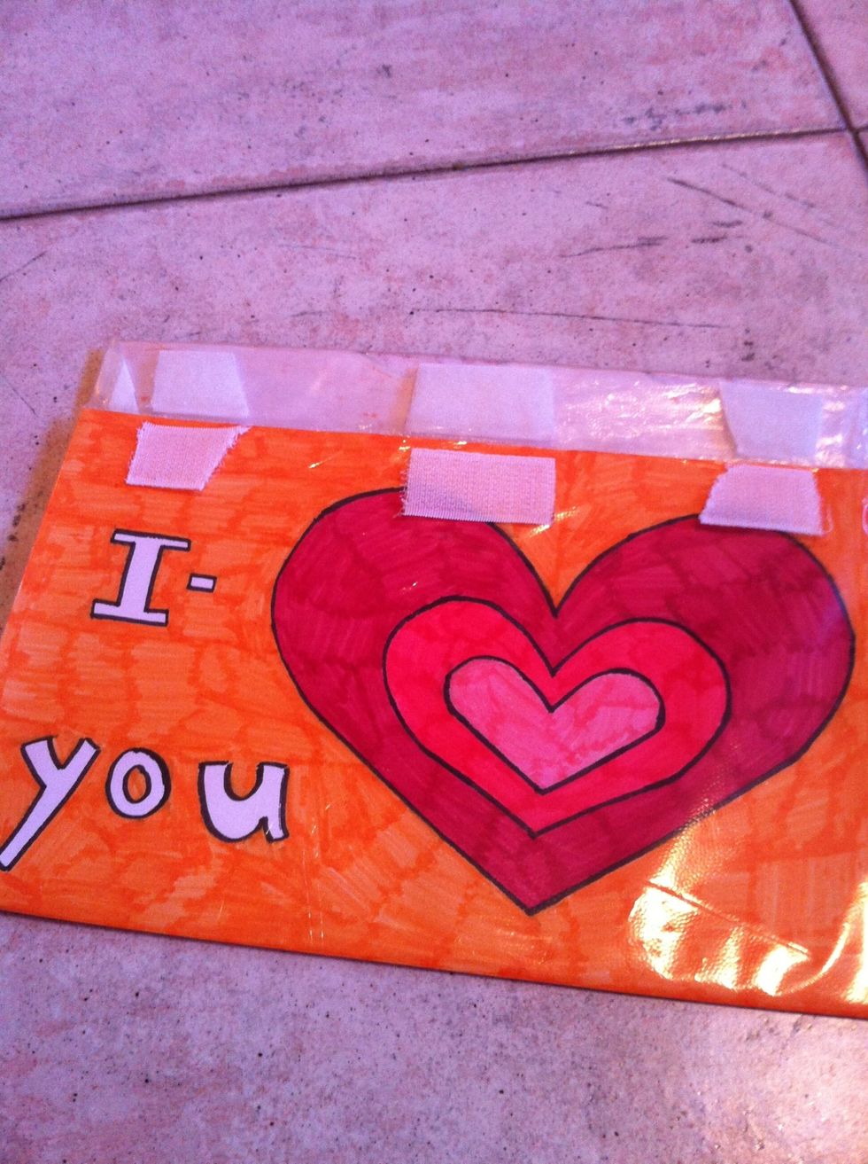 Put one side of the scotch in the front of the wallet, and the other one in the closure of the wallet. Do it few times in few places. Now you can close it!