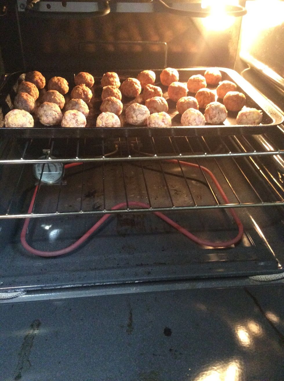 Put one tray of sausage balls in at a time so that both of the trays cook evenly.