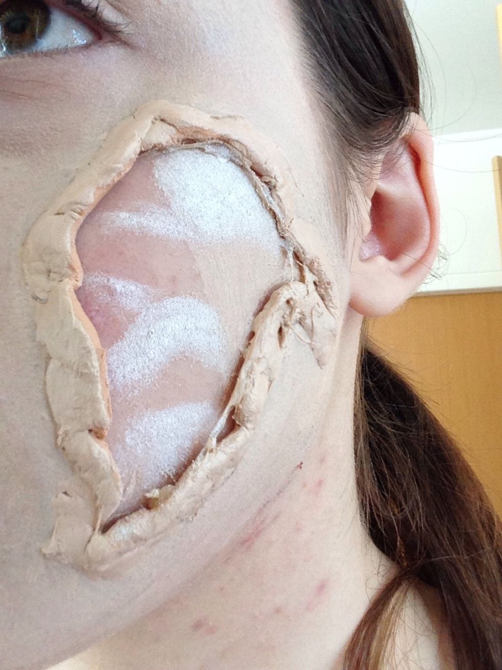 Put one white eyeshadow or face paint